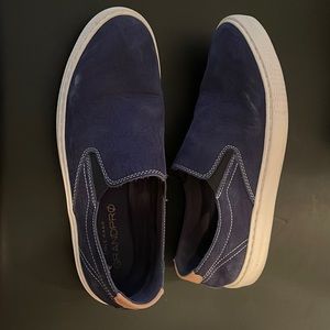 Men’s Cole Haan Grandpro slip on sneaker in navy tumbled Nubuc.